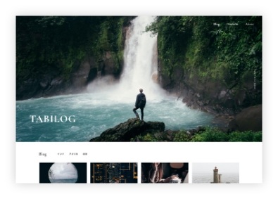 TABILOGのホームページ。壮大な滝のそばに男性が1人立っている写真が使用されているWebサイト